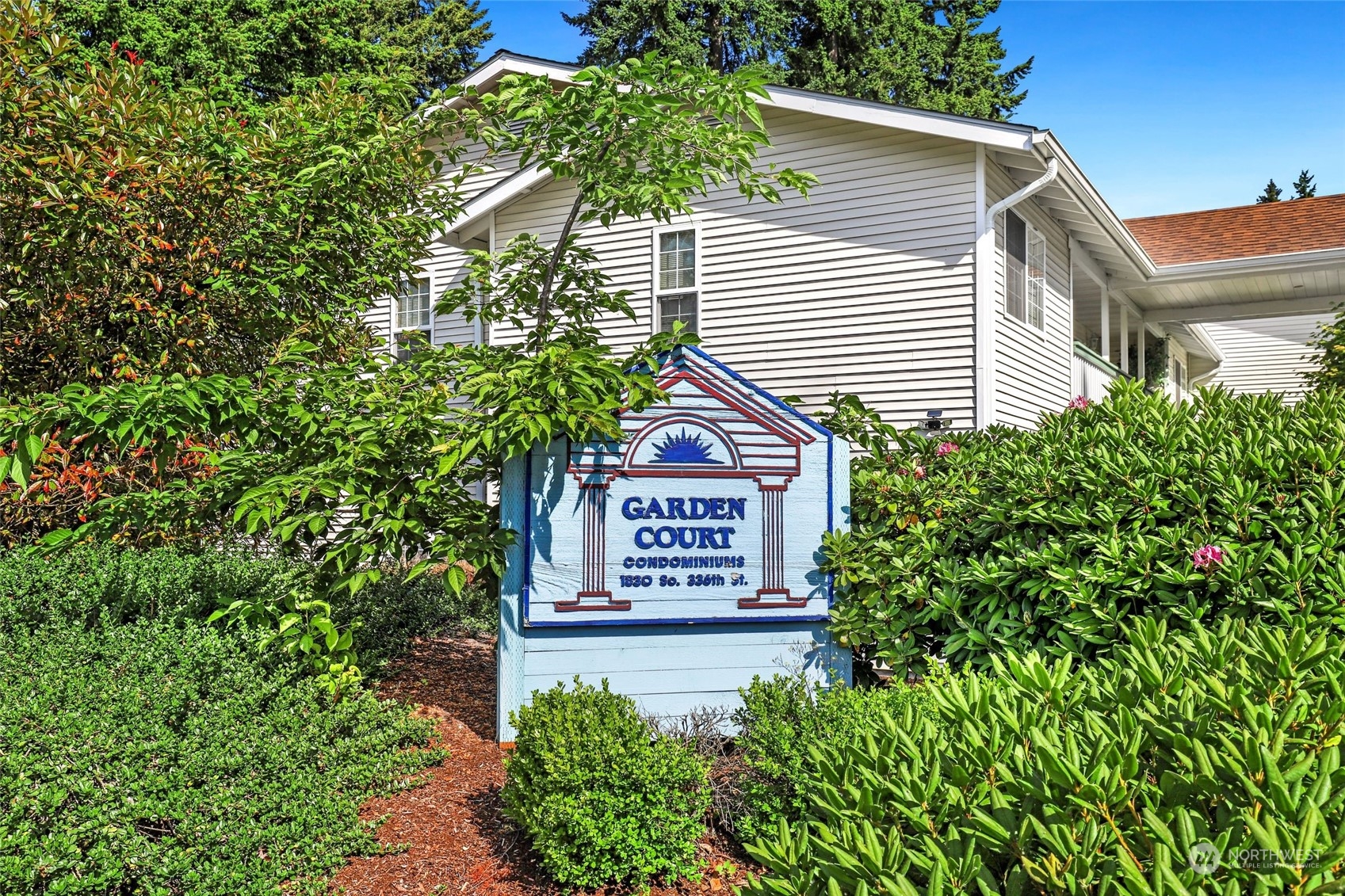 1830 South 336th Street, Unit C201 Federal Way, WA 98003 - Photo 27 of 30 a sign on the side of a building