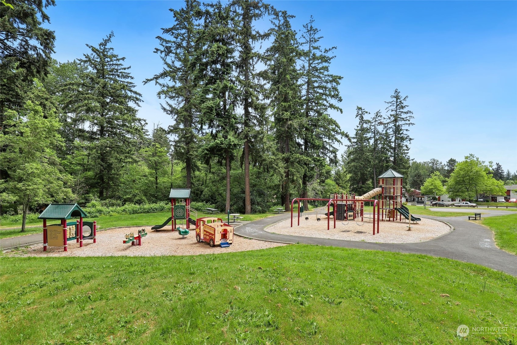 1830 South 336th Street, Unit C201 Federal Way, WA 98003 - Photo 29 of 30 a park with lots of swings and slides