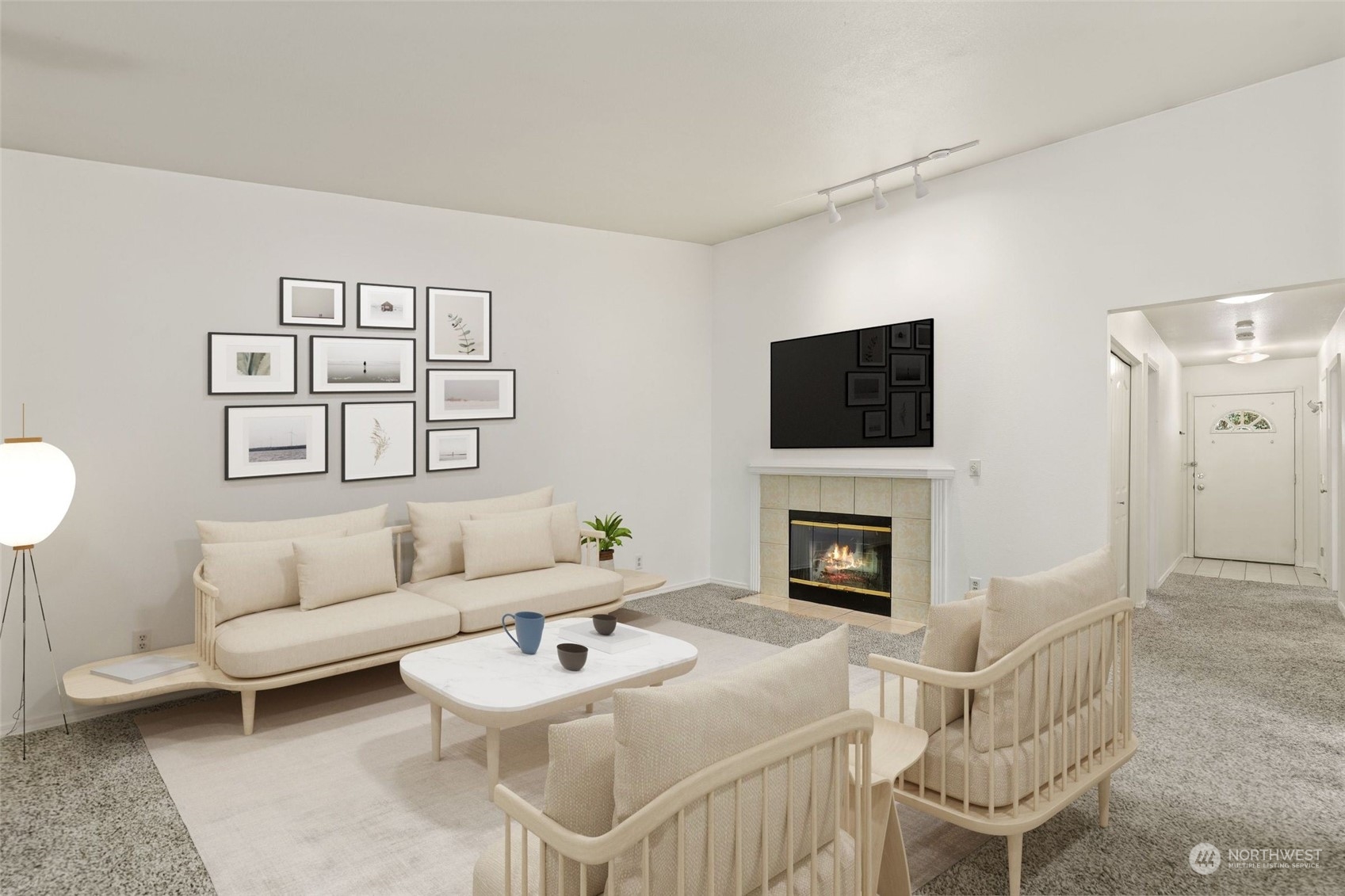 1830 South 336th Street, Unit C201 Federal Way, WA 98003 - Photo 4 of 30 a living room with furniture a fireplace and a flat screen tv