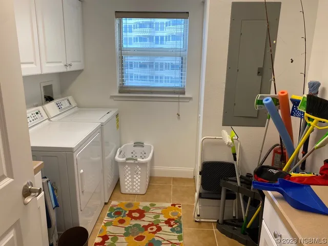 a living room with granite countertop kitchen island furniture and a chandelier