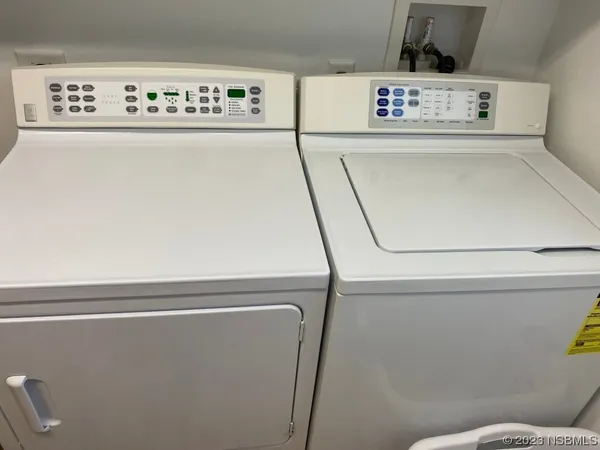 a kitchen with sink refrigerator and window