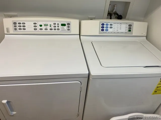 a kitchen with sink refrigerator and window