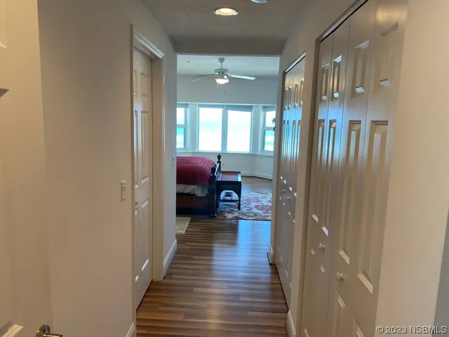 a bedroom with a bed and a night stand