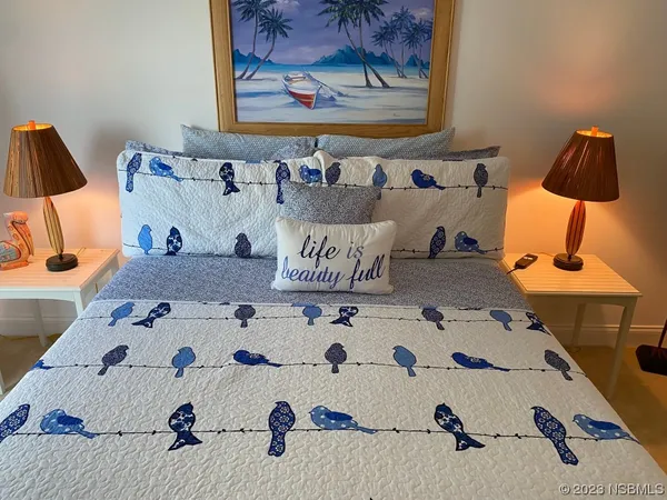 a bedroom with a bed and a cabinets