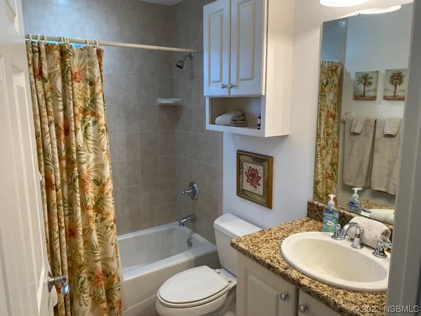 a bedroom with a bed and furniture