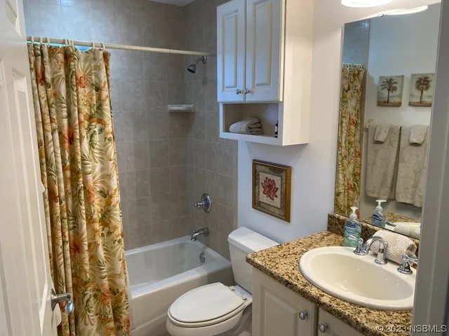 a bedroom with a bed and furniture