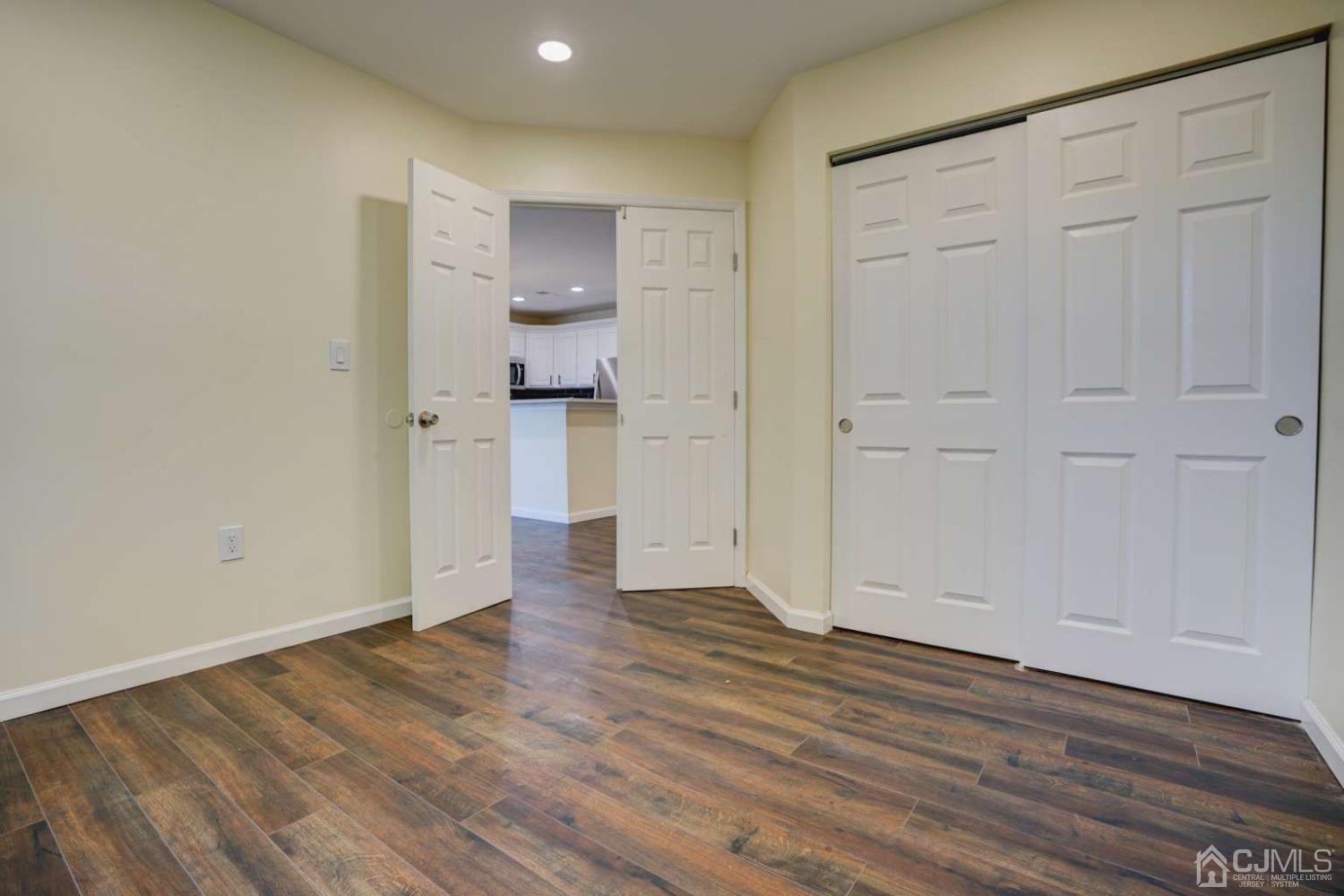 124 Edpas Road New Brunswick, NJ 08901 - Photo 17 of 24 a view of empty room with wooden floor