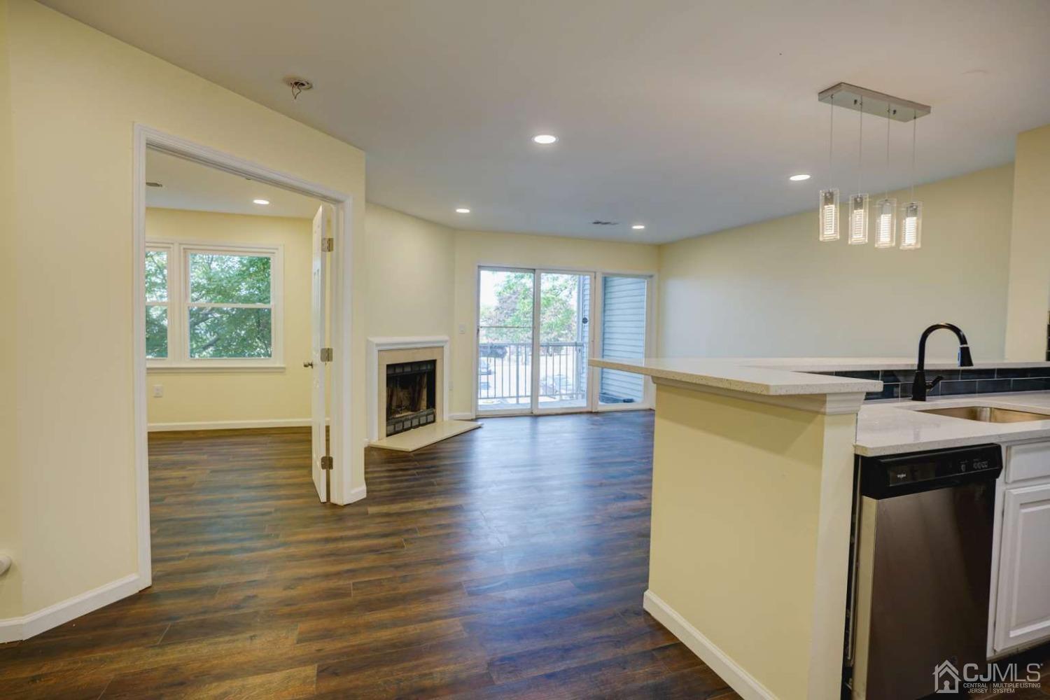 124 Edpas Road New Brunswick, NJ 08901 - Photo 8 of 24 a view of a kitchen with a sink and a fireplace