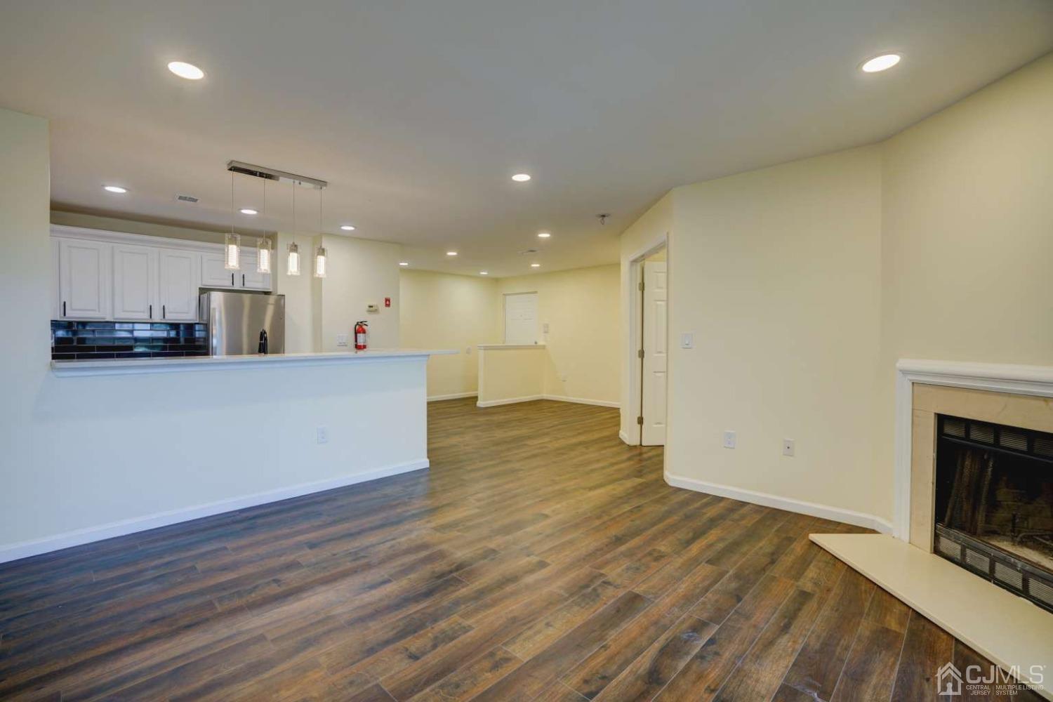 124 Edpas Road New Brunswick, NJ 08901 - Photo 10 of 24 a view of kitchen with kitchen island wooden floor and living room