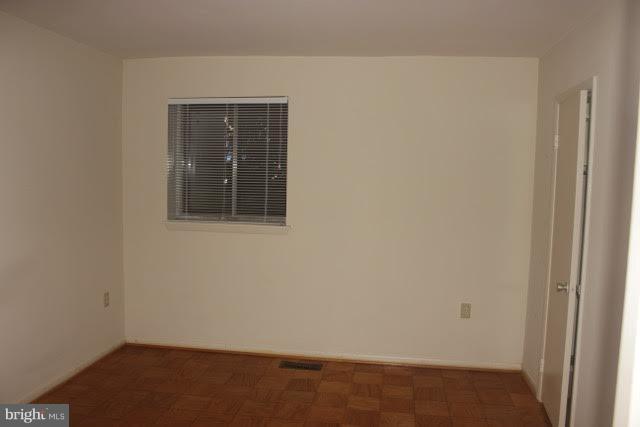 7 Hamill Road, Unit 7B Baltimore, MD 21210 - Photo 9 of 14 a view of an empty room with a window