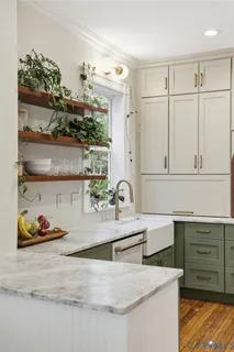 a kitchen with granite countertop a stove and a sink