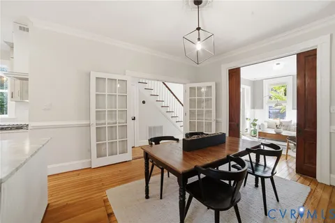 a view of a dining room with furniture window and outside view