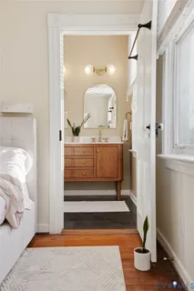 a bathroom with a sink toilet and a mirror