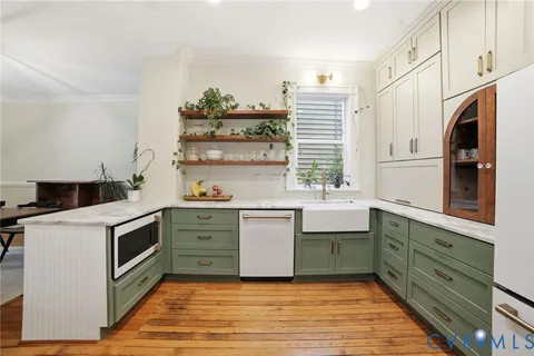 a kitchen with a stove microwave and cabinets