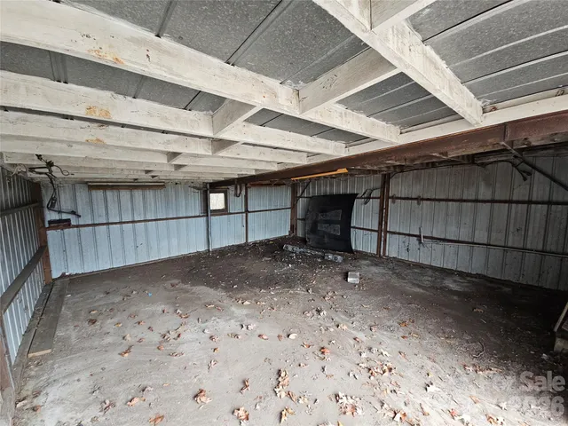 a view of a house with a yard and garage