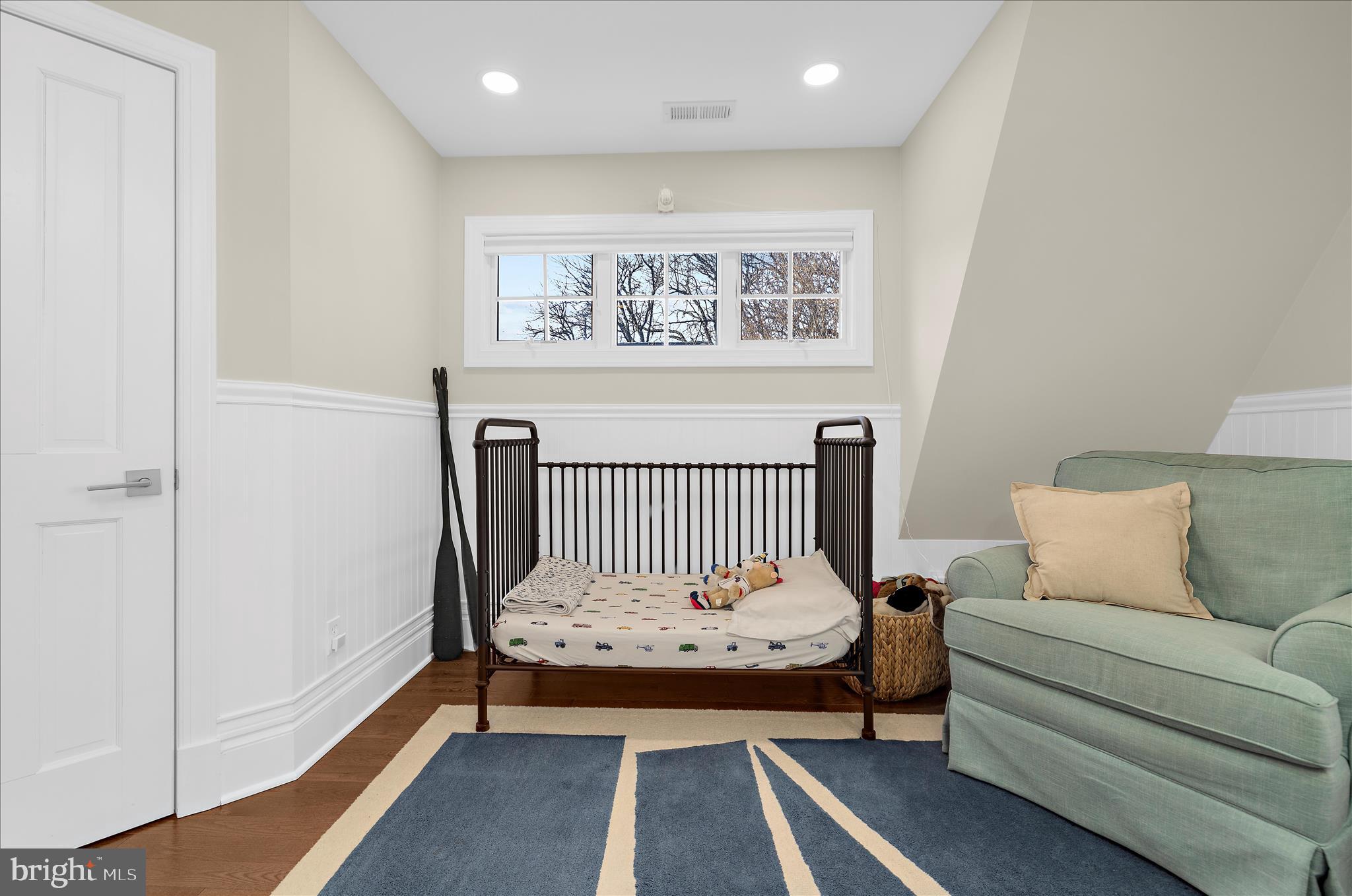 1102 Poplar Avenue Annapolis, MD 21401 - Photo 42 of 125 a bedroom with a bed and painting on the wall