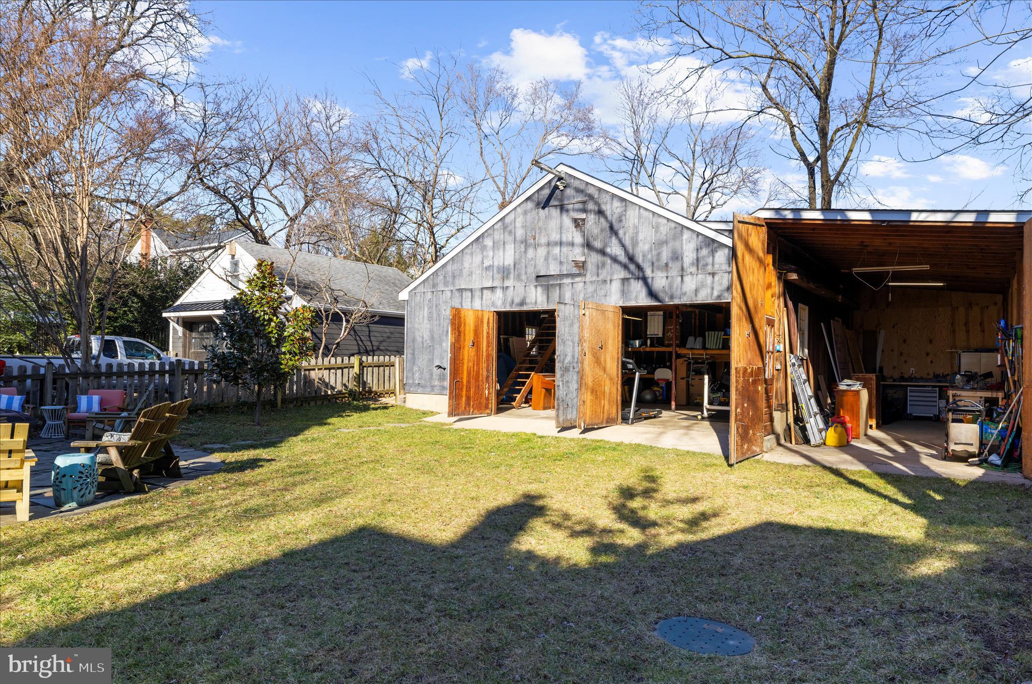 1102 Poplar Avenue Annapolis, MD 21401 - Photo 69 of 125 a front view of a house with a yard outdoor seating and covered with trees