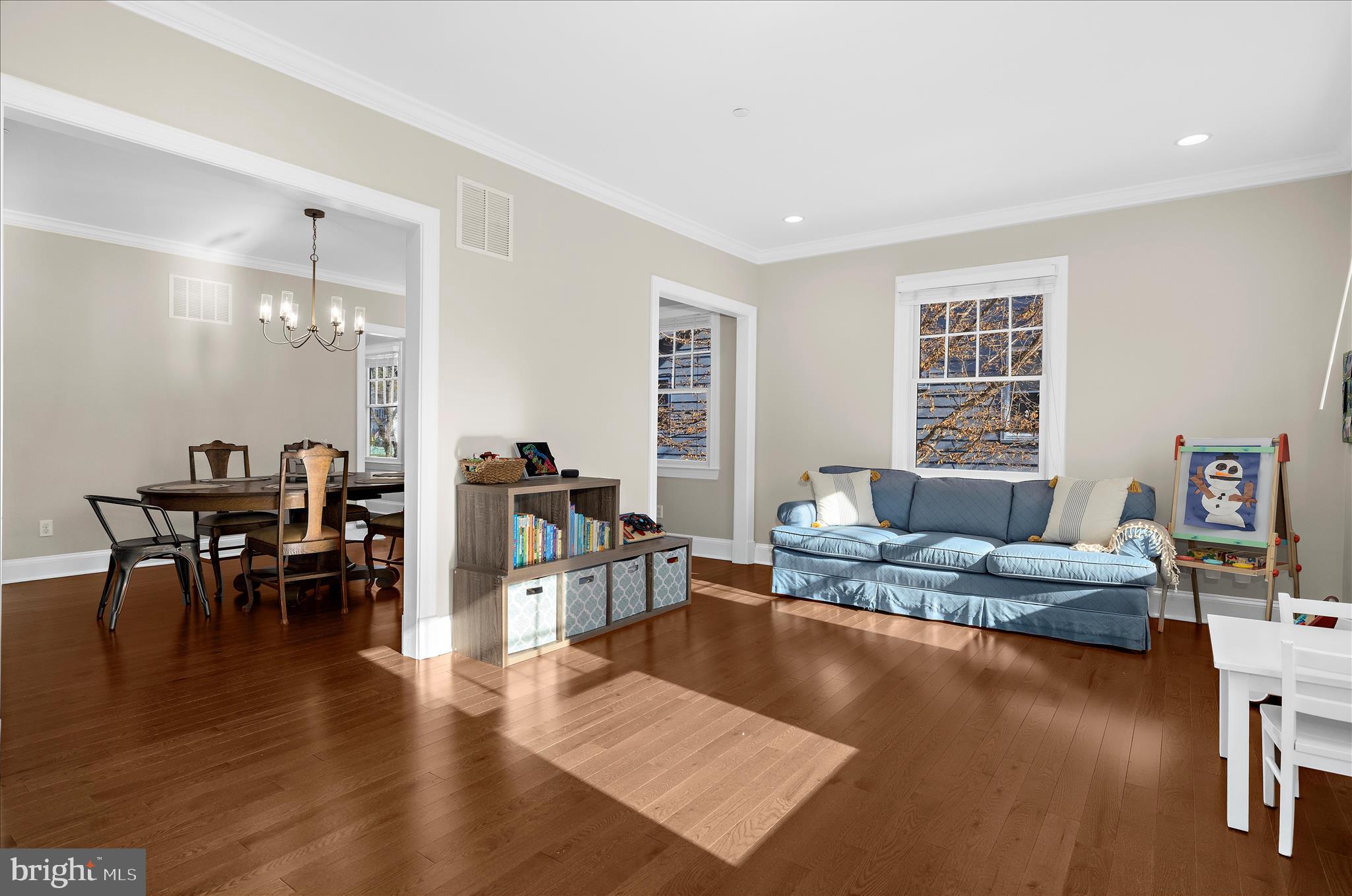 1102 Poplar Avenue Annapolis, MD 21401 - Photo 7 of 125 a living room with furniture and a dining table with wooden floor