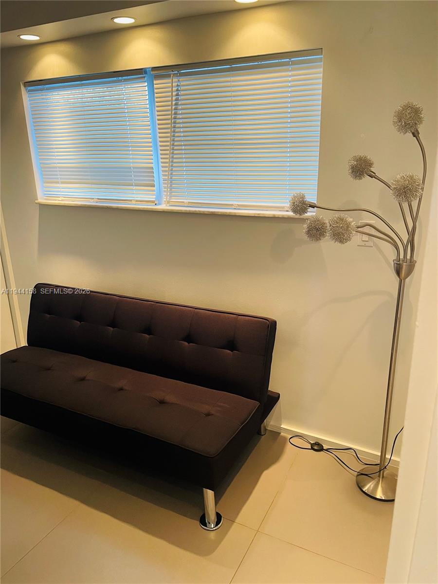 1331 Lincoln Road, Unit 1004 Miami Beach, FL 33139 - Photo 5 of 9 a view of room with a wooden floor