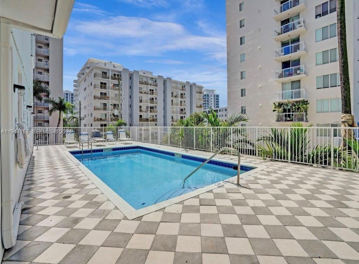 1331 Lincoln Road, Unit 1004 Miami Beach, FL 33139 - Photo 8 of 9 a view of swimming pool with building exterior