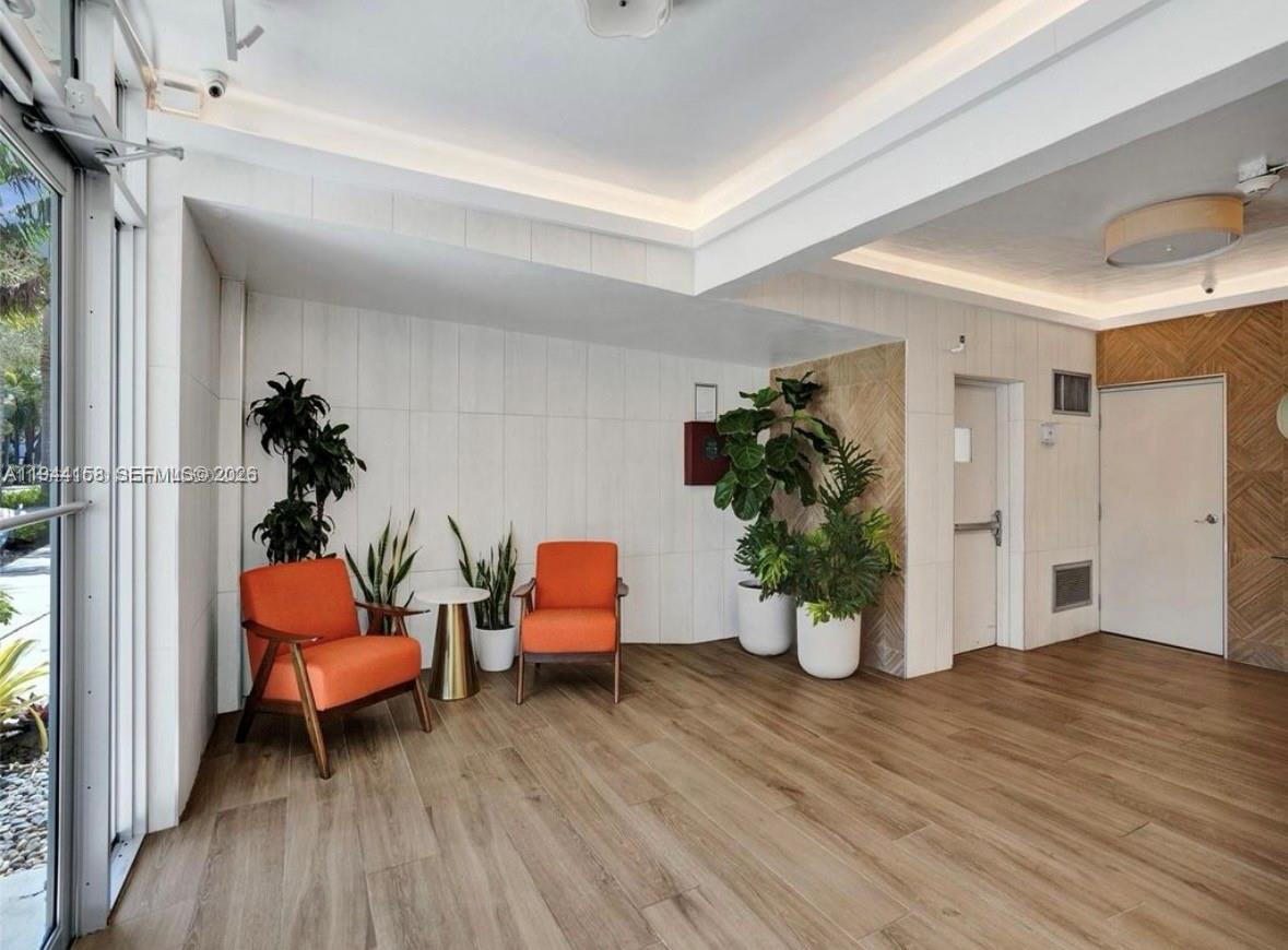 1331 Lincoln Road, Unit 1004 Miami Beach, FL 33139 - Photo 9 of 9 a room with furniture and wooden floor