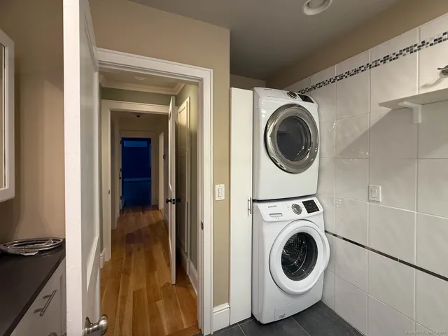 a view of a hallway with washer and dryer
