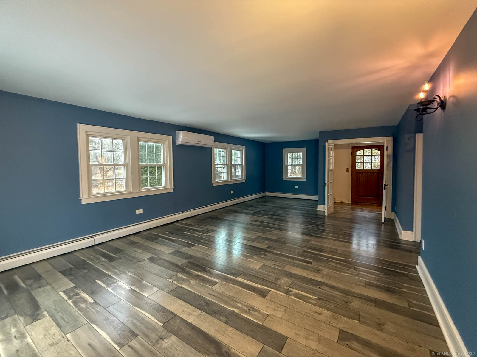 2 Maple Lane New Fairfield, CT 06812 - Photo 21 of 35 a view of empty room with window and wooden floor