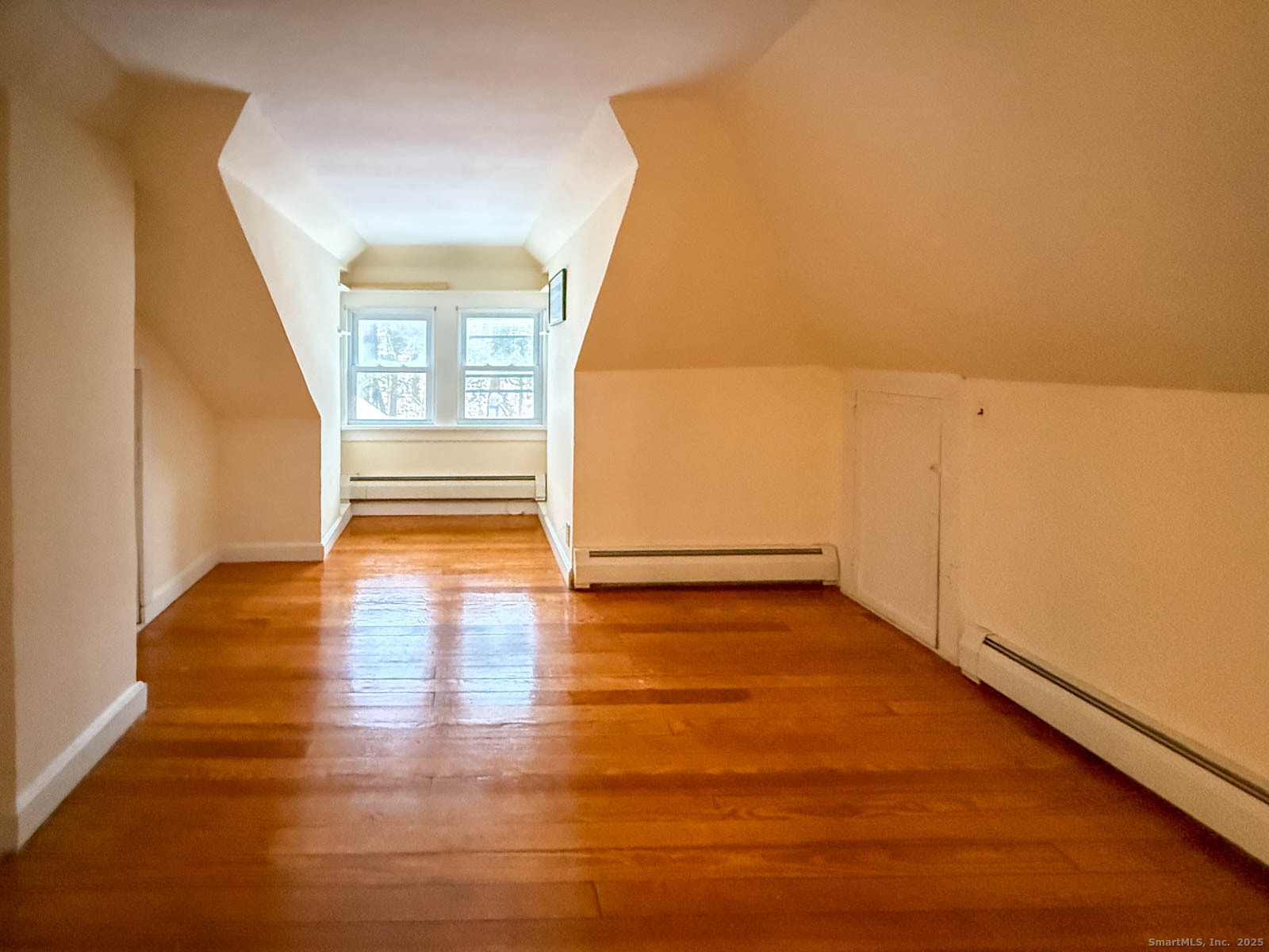 2 Maple Lane New Fairfield, CT 06812 - Photo 26 of 35 a view of an empty room with wooden floor