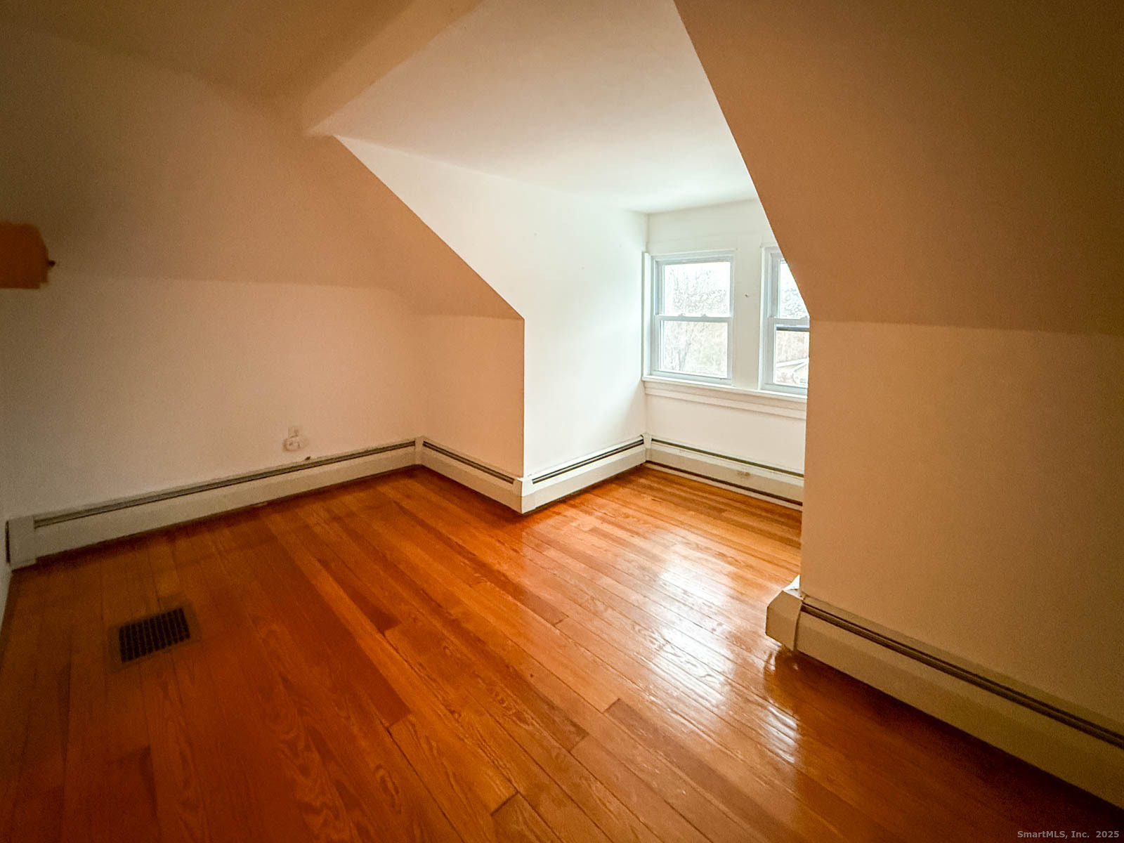 2 Maple Lane New Fairfield, CT 06812 - Photo 30 of 35 an empty room with wooden floor and windows