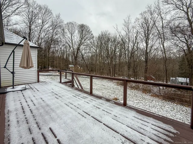 a view of a house with a snow on the road