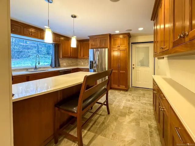 a bathroom with a sink a large mirror and a shower