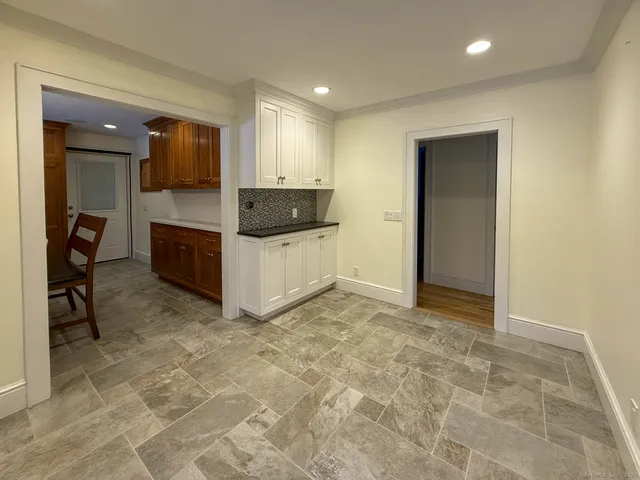 a view of living room with furniture and a rug