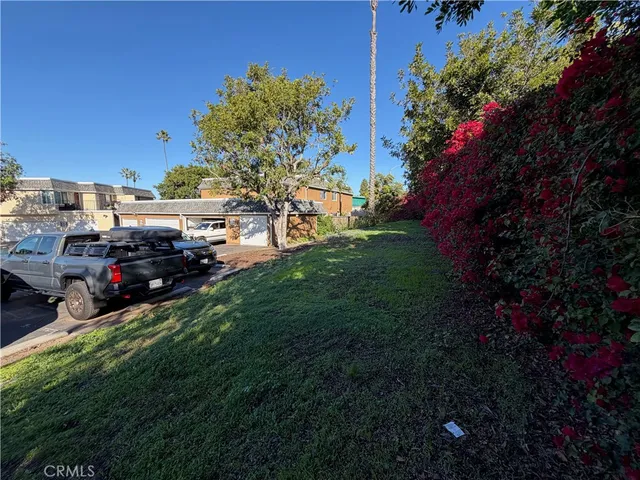 a view of a car parked in the yard
