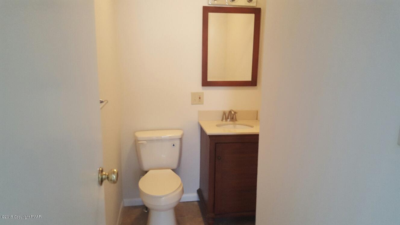 46 Dancing Ridge Road East Stroudsburg, PA 18302 - Photo 11 of 16 a bathroom with a toilet sink and mirror