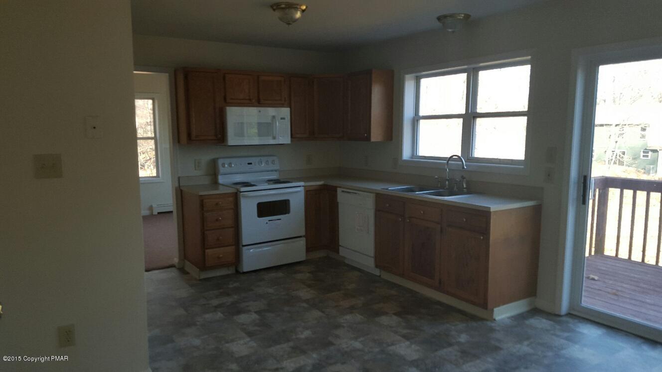 46 Dancing Ridge Road East Stroudsburg, PA 18302 - Photo 12 of 16 a kitchen that has a sink and a stove