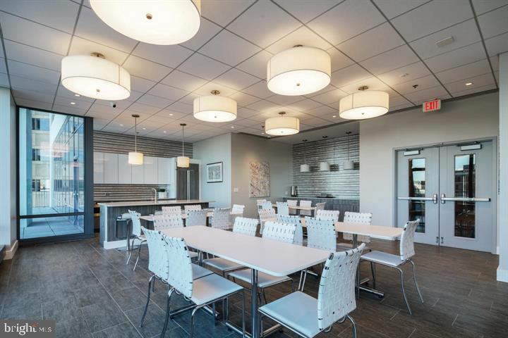 2101 Market Street, Unit 4205 Philadelphia, PA 19103 - Photo 26 of 31 a view of a dining area with furniture and wooden floor