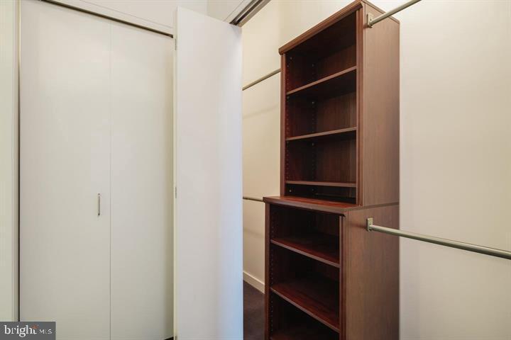 2101 Market Street, Unit 4205 Philadelphia, PA 19103 - Photo 3 of 31 a view of walk in closet with empty racks