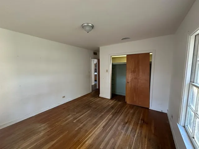 a bathroom with a window bathtub and toilet