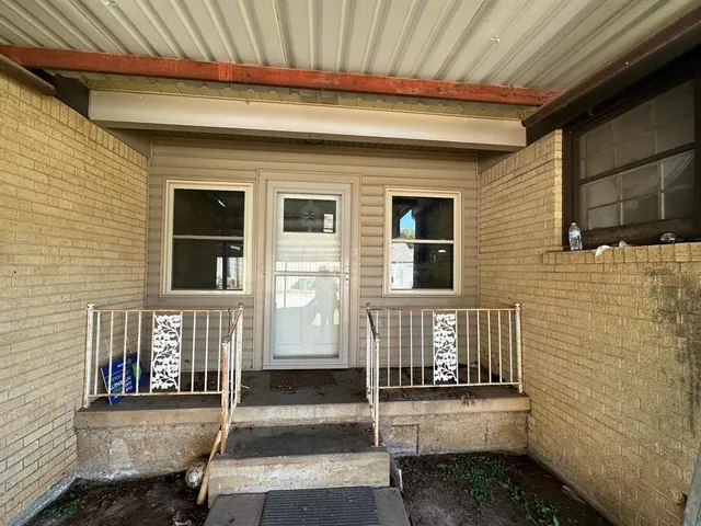 a front view of a house with stairs