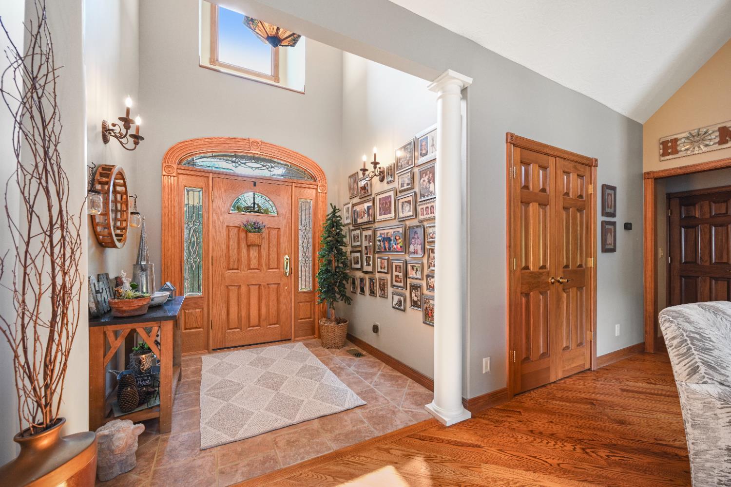 12656 Asche Road Sunman, IN 47041 - Photo 12 of 82 The stunning foyer is 18 ft high, loaded with natural light & accented by a leaded glass chandelier & side pillar