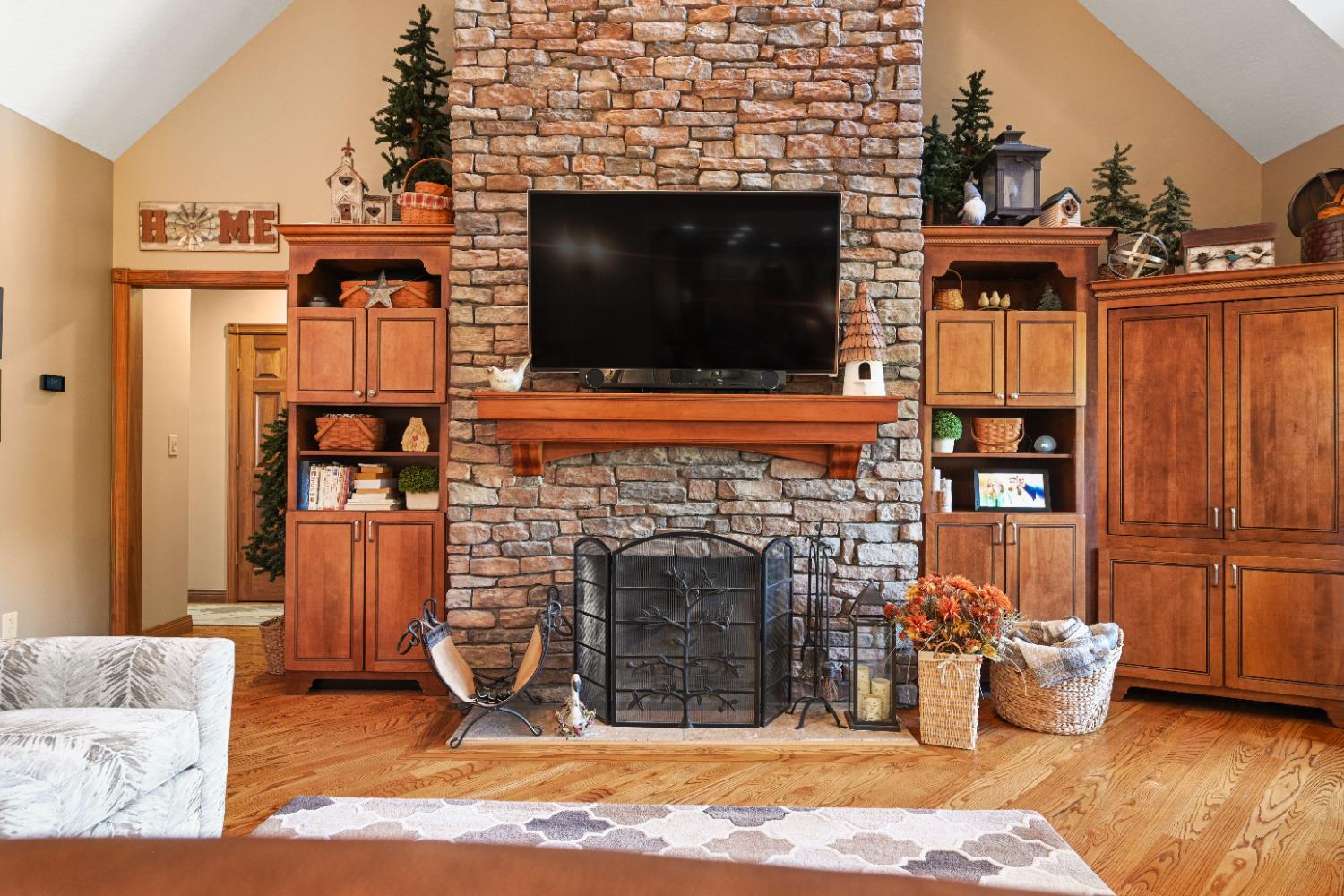 12656 Asche Road Sunman, IN 47041 - Photo 14 of 82 Custom built-ins surround the fireplace, and were made to match the kitchen & dining room cabinets