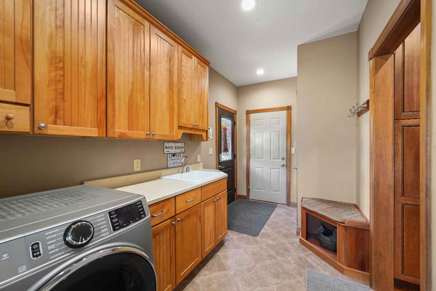 12656 Asche Road Sunman, IN 47041 - Photo 30 of 82 The Mud room even features a custom bench seat for putting on your shoes! Doors lead out to the garage & the side yard...