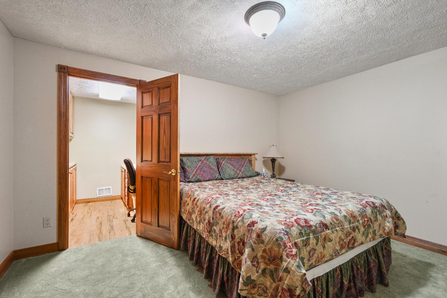 12656 Asche Road Sunman, IN 47041 - Photo 47 of 82 You thought that was a closet door? Surprise! It's the entrance to a custom sewing/craft room!