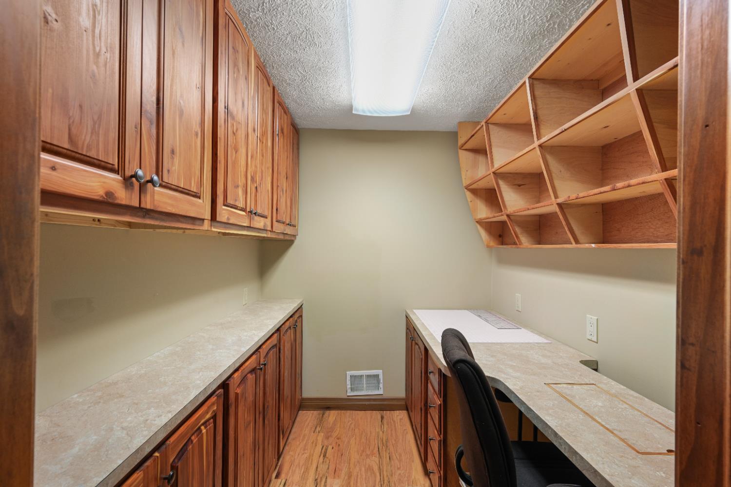 12656 Asche Road Sunman, IN 47041 - Photo 48 of 82 The sewing/craft room abounds with custom built cabinets & cubbies to make organizing easy! There's even a spot for the sewing machine in the counter!