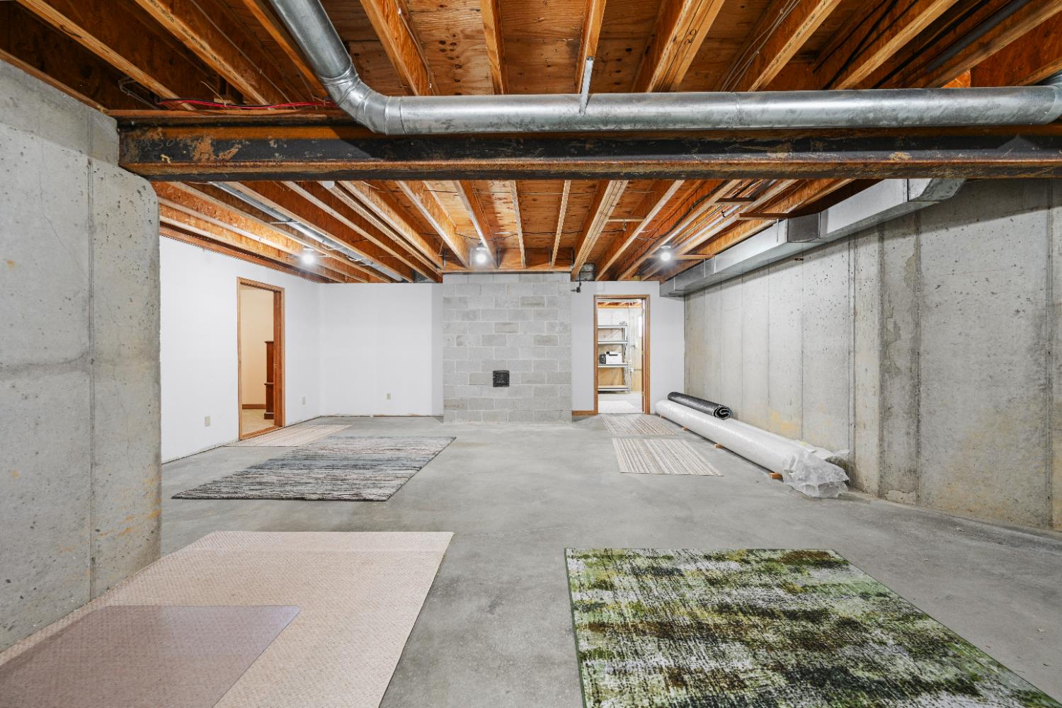 12656 Asche Road Sunman, IN 47041 - Photo 52 of 82 View of the future Family Room area from the base of the stairs. A portion of the basement has been divided into a huge utility/storage area!