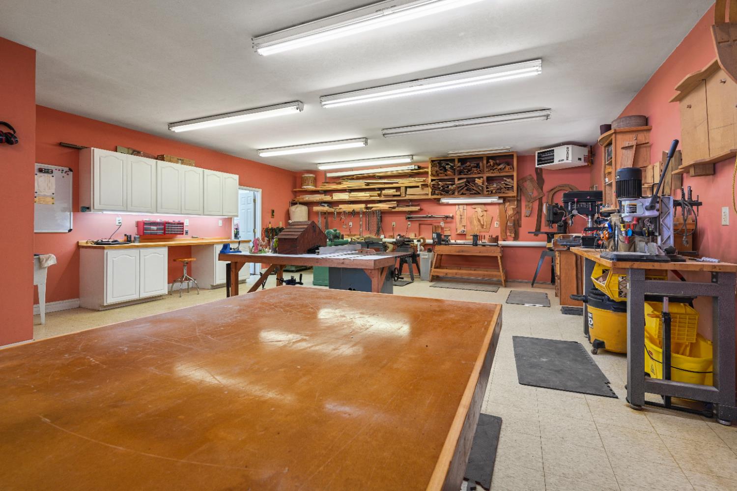 12656 Asche Road Sunman, IN 47041 - Photo 57 of 82 The workshop has custom shelving to hold supplies, and lots of space to work on large items
