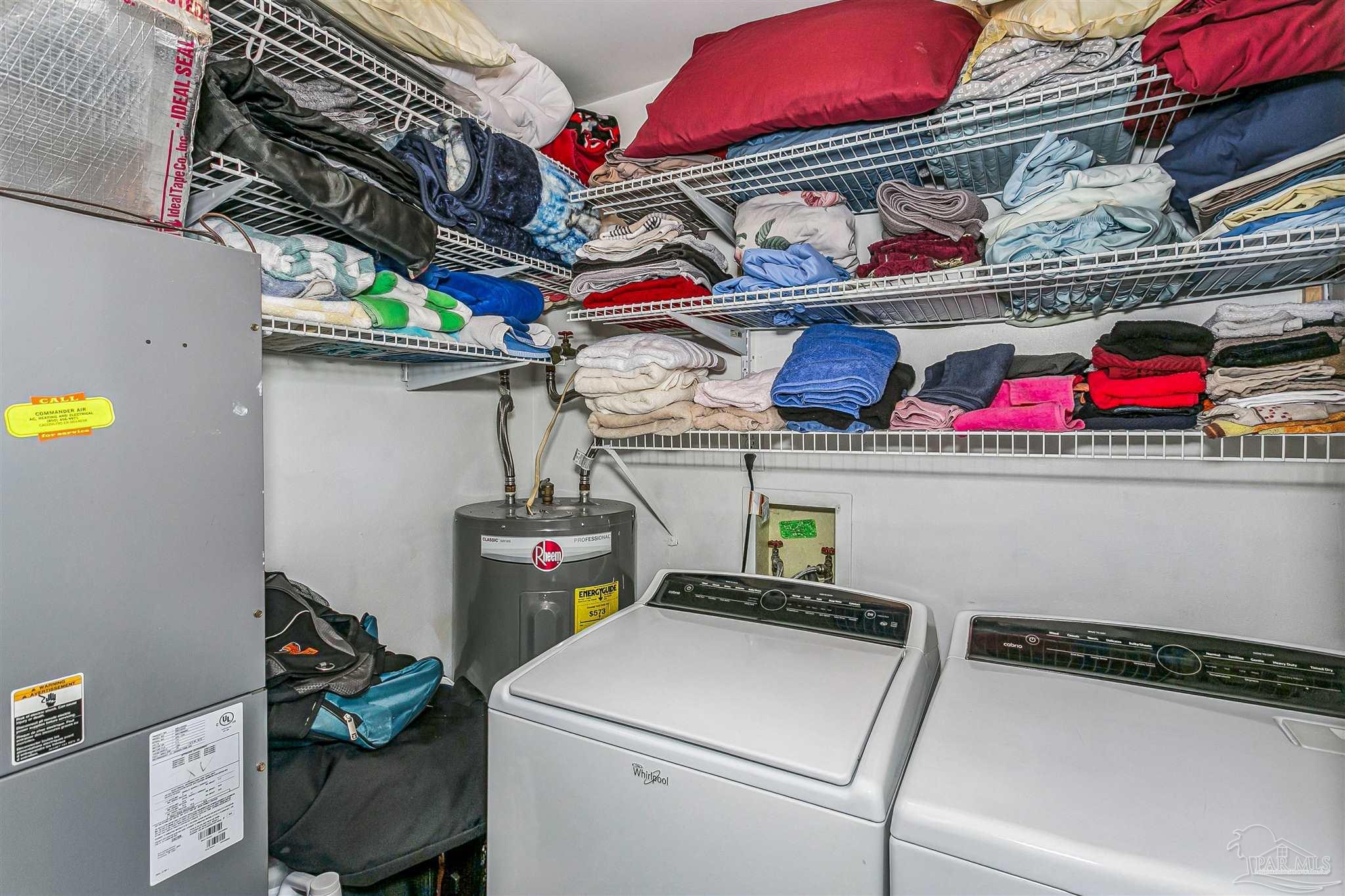 4831 East Olive Road, Unit 2D Pensacola, FL 32514 - Photo 19 of 29 a utility room with dryer washer and closet
