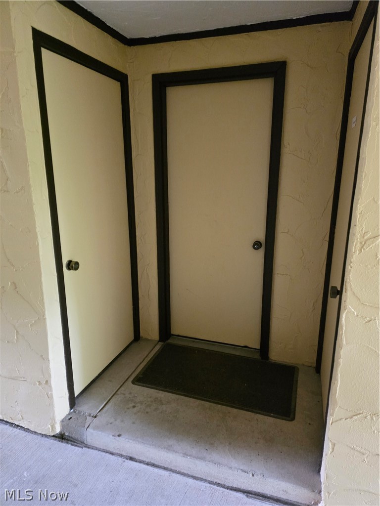 879 Hampton Ridge Drive Akron, OH 44313 - Photo 29 of 32 Garage Entry from Vestibule. Closet is to the left.