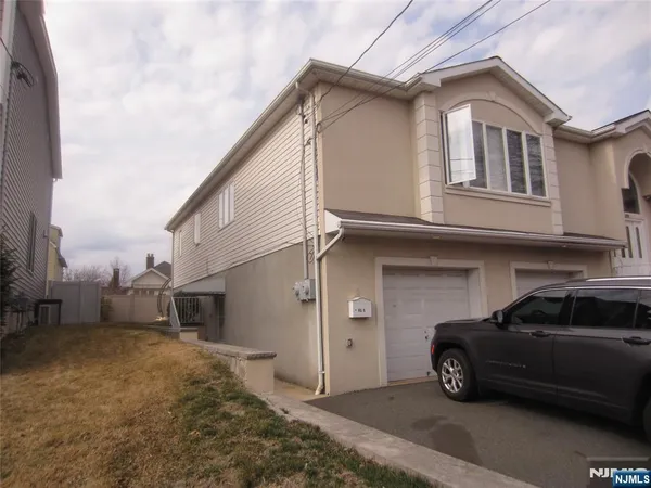 a car parked in front of a house