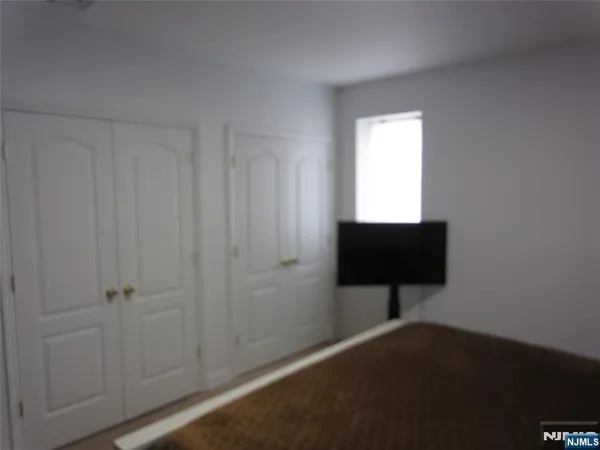 a room with a bench and a window